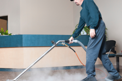 Man cleaning a carpet